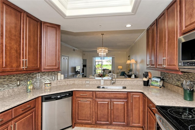 kitchen featuring an inviting chandelier, a sink, decorative backsplash, appliances with stainless steel finishes, and crown molding