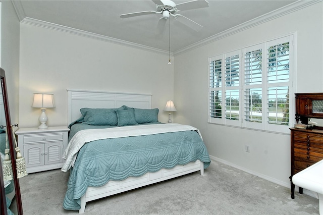 bedroom featuring carpet flooring, a ceiling fan, baseboards, and ornamental molding