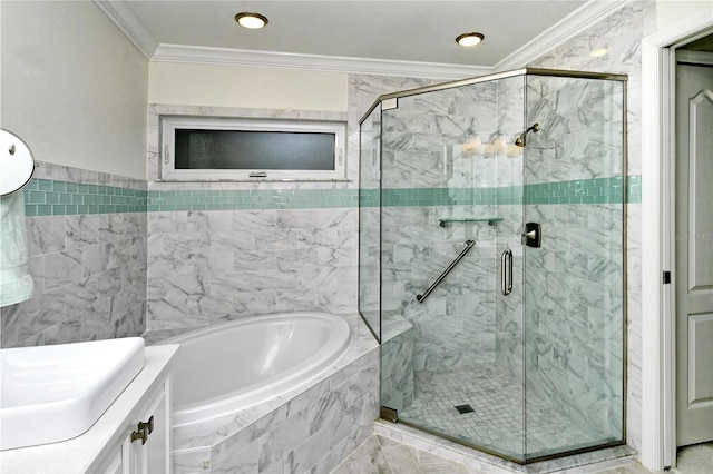 full bathroom with vanity, a garden tub, a shower stall, and ornamental molding