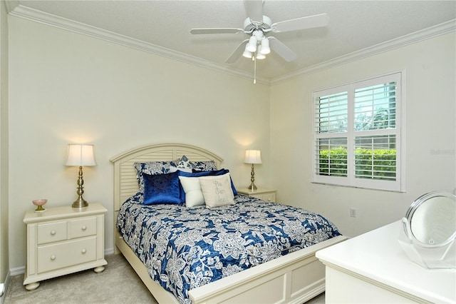 bedroom with light colored carpet, ornamental molding, and a ceiling fan