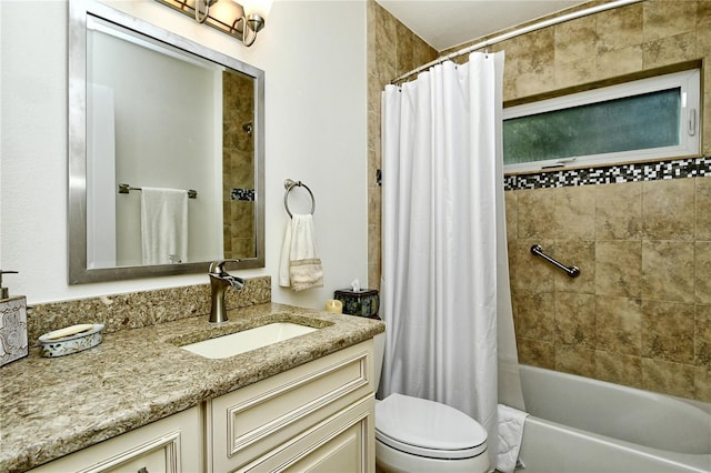 bathroom featuring shower / tub combo with curtain, toilet, and vanity