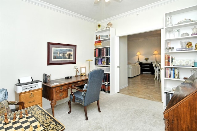 office space with ceiling fan, ornamental molding, light tile patterned flooring, and light carpet