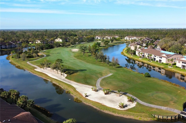 aerial view featuring a water view and view of golf course