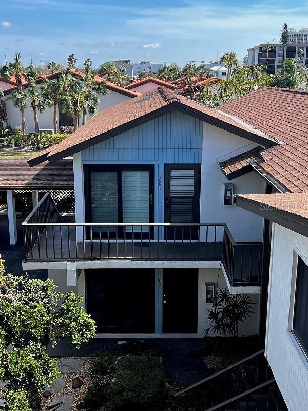722 S Blvd Of The Presidents Unit 201, Sarasota, FL 34236 - view of front of property with a balcony and stucco siding