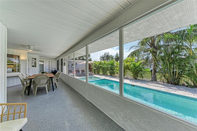 view of swimming pool featuring outdoor dining space, a fenced in pool, a fenced backyard, ceiling fan, and a patio area