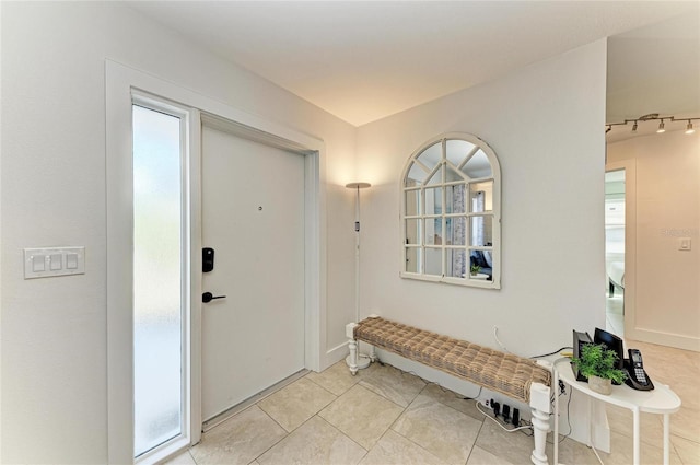 entrance foyer with light tile patterned floors