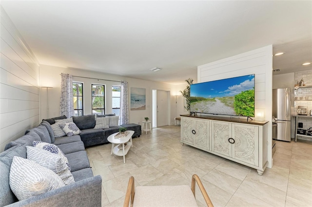 living area with visible vents and recessed lighting