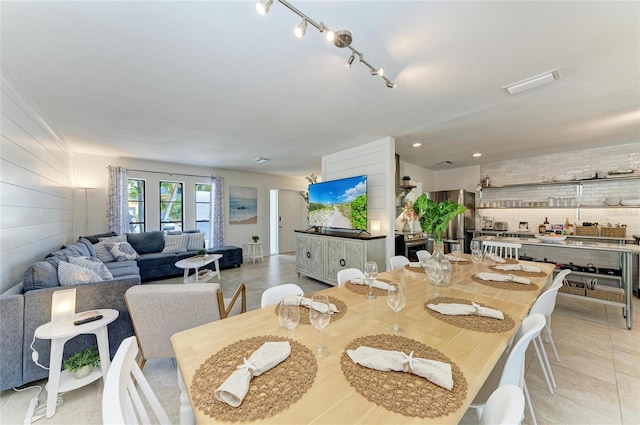 dining space featuring light tile patterned floors and recessed lighting