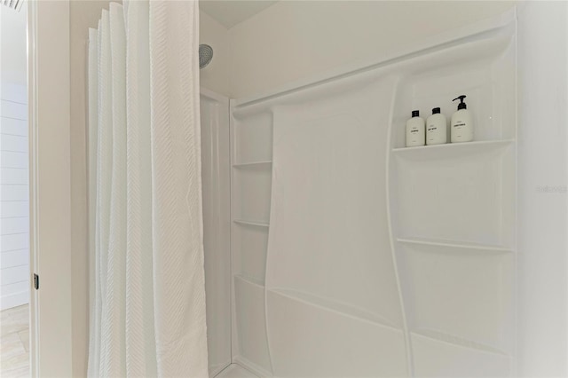 room details with a shower with shower curtain