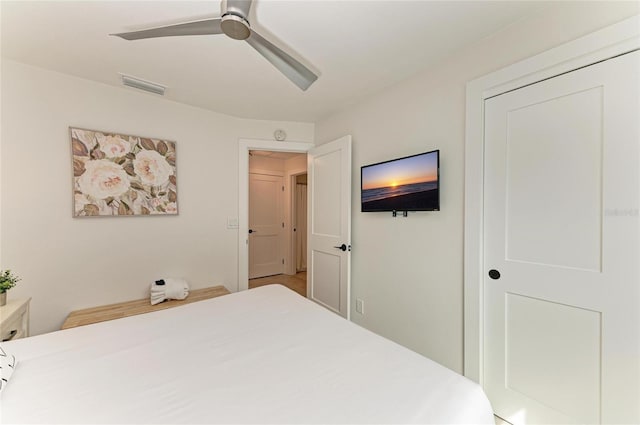 bedroom featuring visible vents and ceiling fan