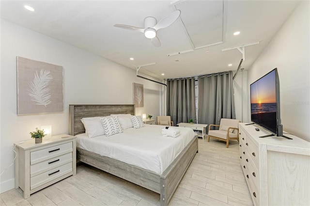 bedroom featuring recessed lighting, attic access, and a ceiling fan