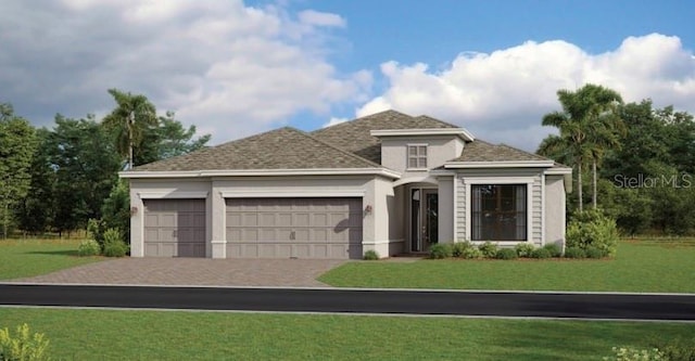 view of front of house featuring stucco siding, driveway, an attached garage, and a front lawn