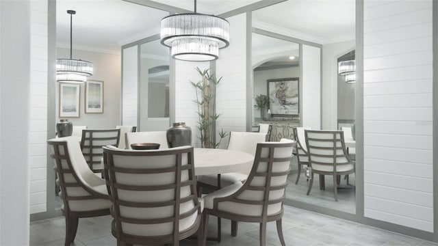 dining area featuring ornamental molding and a chandelier