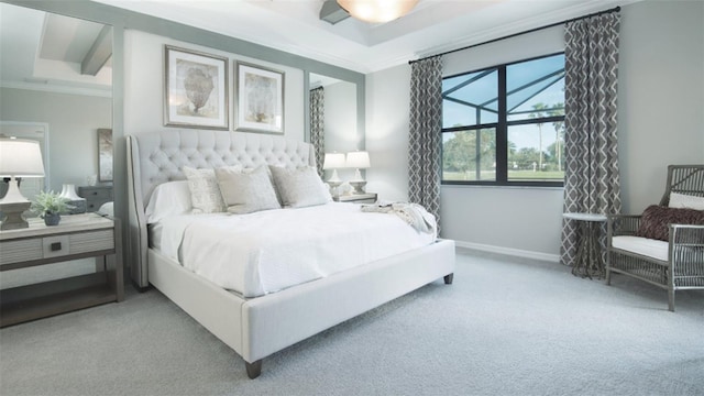 carpeted bedroom with crown molding and baseboards