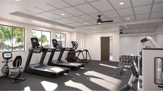 exercise room with a ceiling fan, recessed lighting, a paneled ceiling, and baseboards