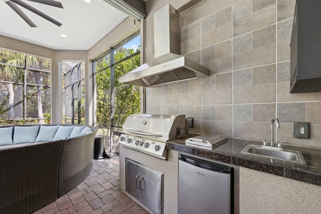 exterior space featuring ceiling fan and a sink