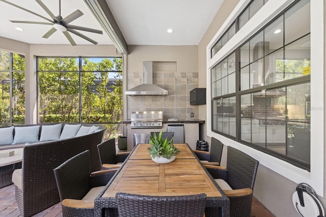 sunroom / solarium with a ceiling fan