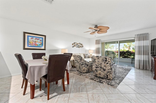 dining space with visible vents, baseboards, and ceiling fan