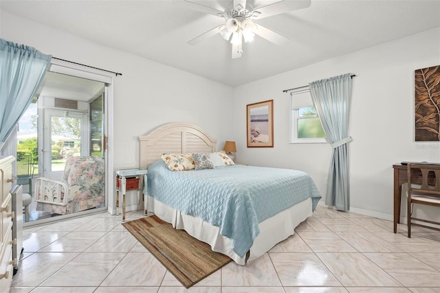 bedroom featuring a ceiling fan and baseboards