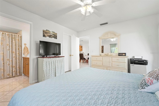 tiled bedroom featuring visible vents and ceiling fan