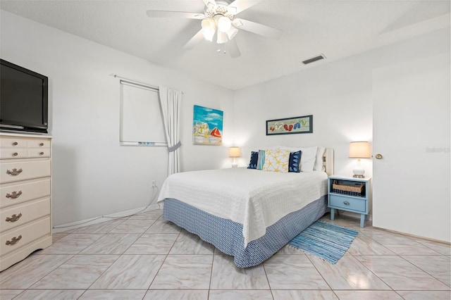 bedroom with visible vents, marble finish floor, and a ceiling fan