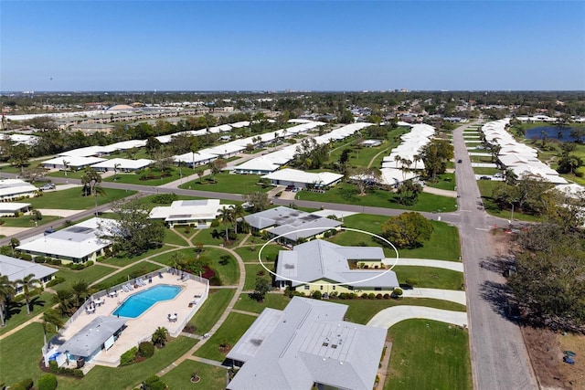 birds eye view of property with a residential view