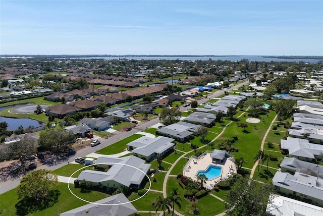 birds eye view of property featuring a residential view and a water view