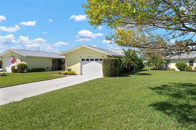 single story home featuring a garage, driveway, and a front yard