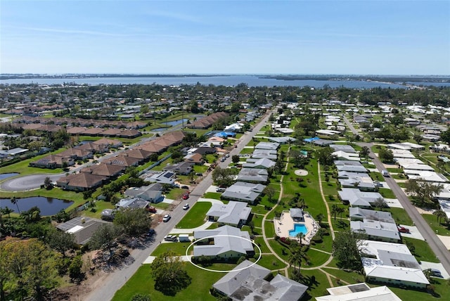 bird's eye view with a residential view and a water view