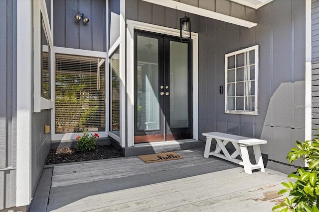 view of exterior entry featuring board and batten siding