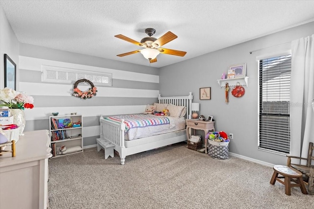 bedroom with baseboards, a textured ceiling, ceiling fan, and carpet flooring