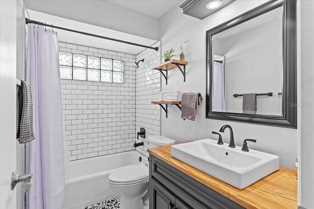 full bath with vanity, shower / bath combination with curtain, and toilet