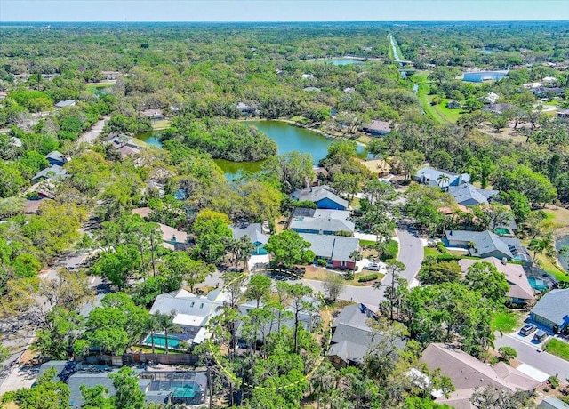 bird's eye view featuring a residential view, a forest view, and a water view