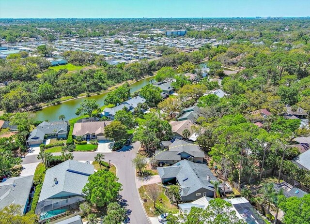 drone / aerial view featuring a residential view and a water view