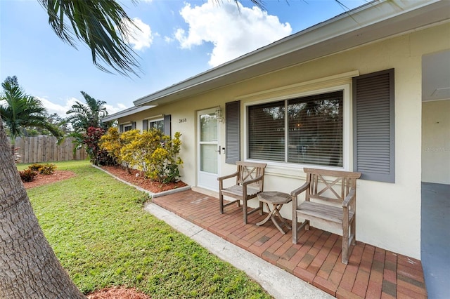 exterior space with a patio, a yard, and fence