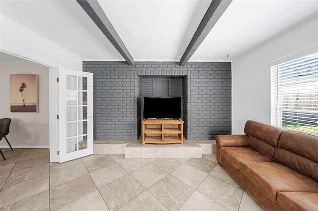 living room with beam ceiling, light tile patterned flooring, and baseboards