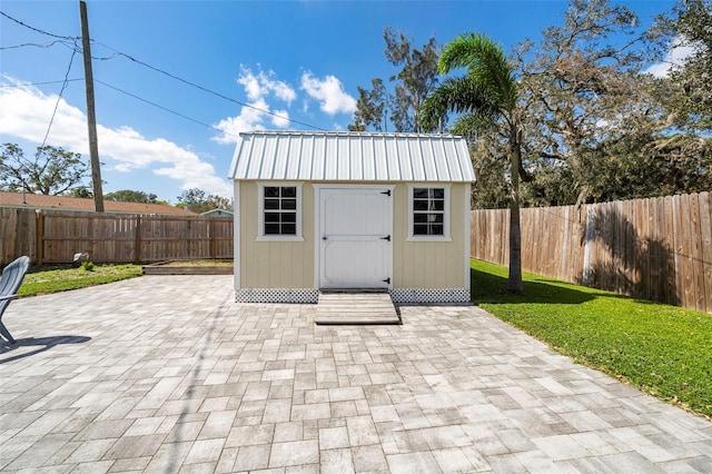 view of shed featuring a fenced backyard