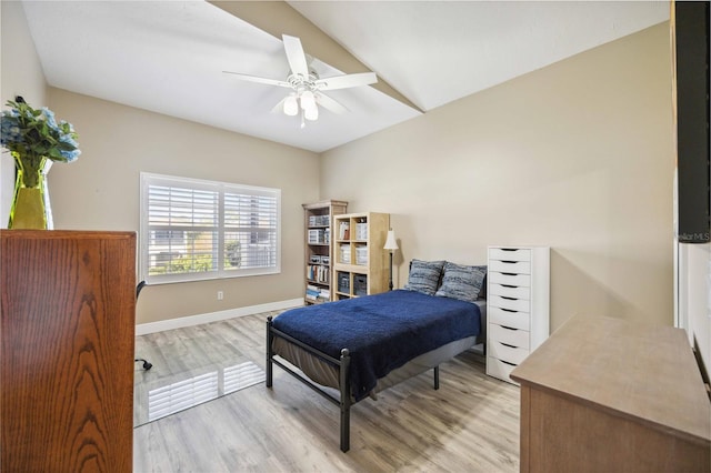 bedroom with ceiling fan, light wood-type flooring, and baseboards