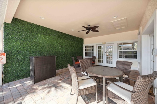 view of patio / terrace featuring french doors, outdoor dining area, and ceiling fan