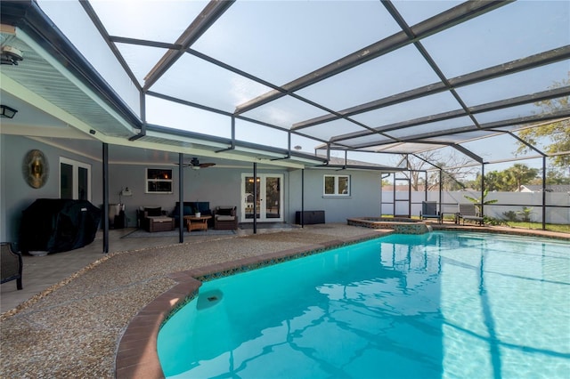 view of pool featuring area for grilling, a patio, french doors, glass enclosure, and ceiling fan