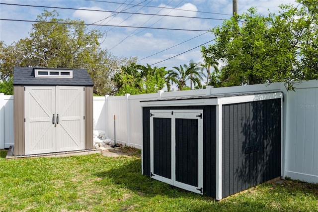 view of shed featuring a fenced backyard