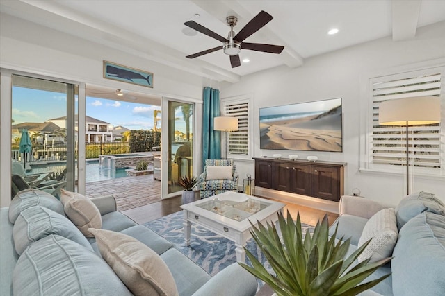 living room with beam ceiling, recessed lighting, ceiling fan, and wood finished floors