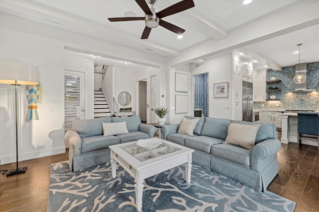 living room featuring beamed ceiling, dark wood-style floors, recessed lighting, baseboards, and stairs