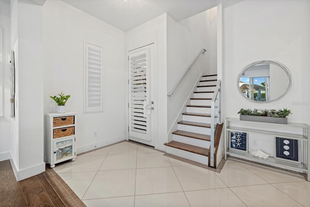 interior space with tile patterned floors and baseboards