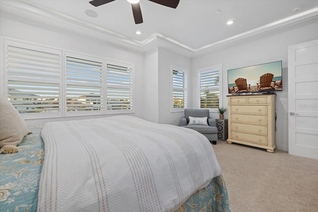 bedroom featuring recessed lighting, light colored carpet, a tray ceiling, and a ceiling fan