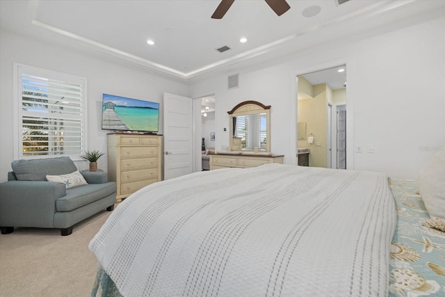 bedroom featuring a tray ceiling, visible vents, light colored carpet, and recessed lighting