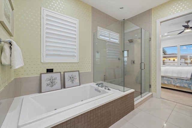 bathroom with tile patterned flooring, a stall shower, wallpapered walls, and ensuite bathroom