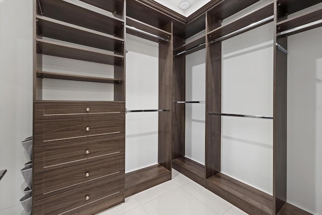 spacious closet featuring light tile patterned flooring