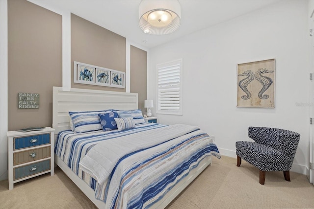 carpeted bedroom with baseboards