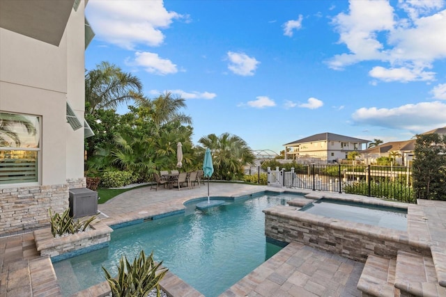 view of pool featuring a patio, outdoor dining area, fence, and a residential view